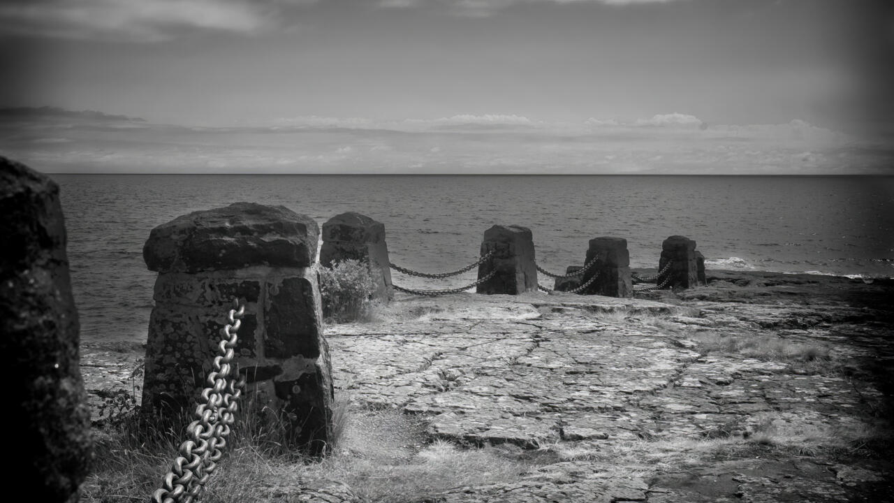 ocean shot pier black and white