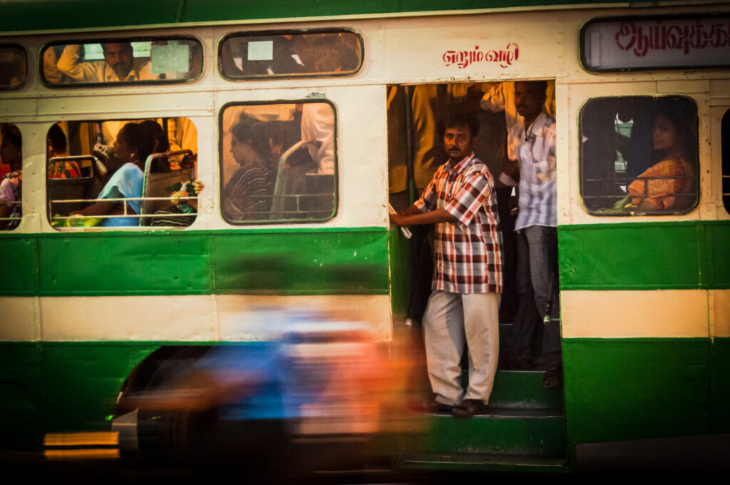 Passengers on a speeding bus in Chenna, India