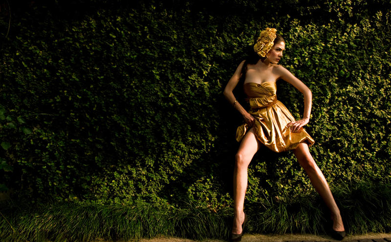 a person in a dress walking in the woods