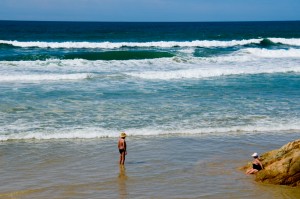 a couple people on a beach