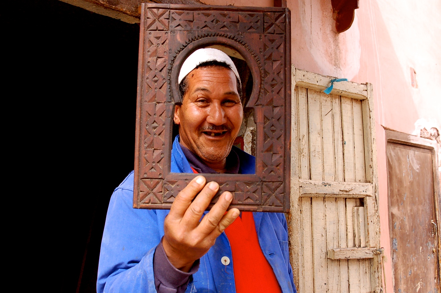 Moroccan frame maker at a market