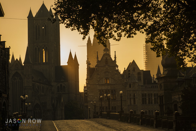 Sunrises behind the medeival city of Ghent as seen from St Michaels Bridge