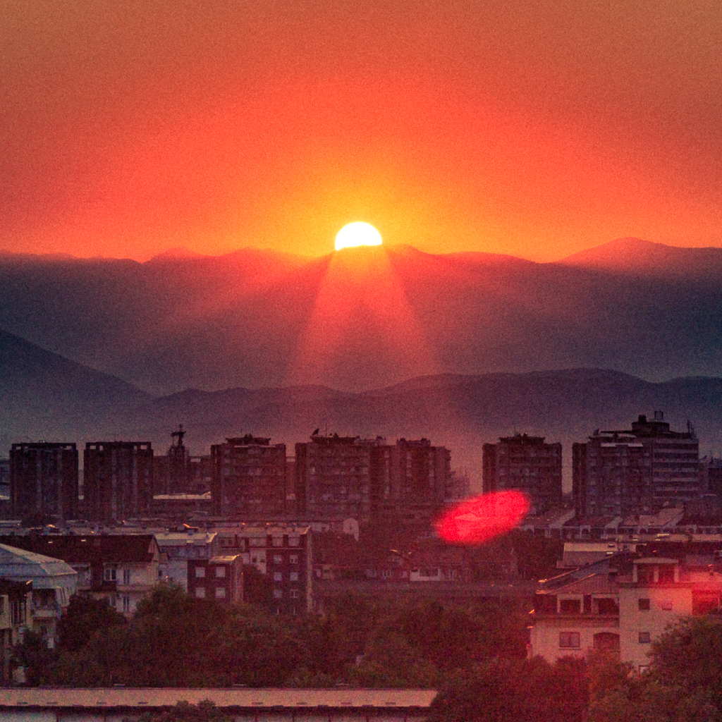 Photo by Dzvonko Petrovski. Note how the image is separated in thirds. The sky is roughly one third, the layering in the mountains is roughly one third, and the rest of it is the city.