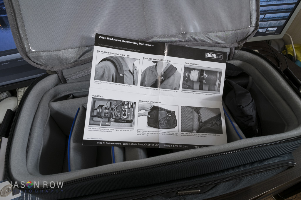 A camera bag with instruction manual.