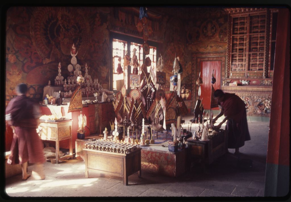 Altar with butter lamps, butter paste offerings (torma) and images to be burned at the end of New Year's ceremony in the palace monastery, Gangtok, Sikkim