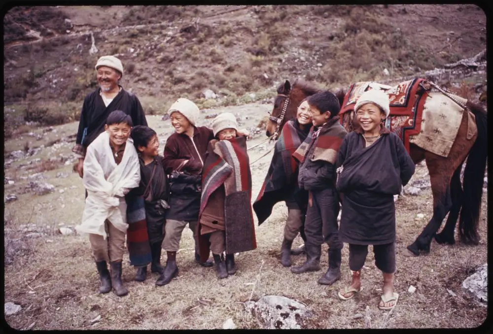  Photograph shows headman of village, Pipon, with group of children and a horse, Lachung, Sikkim