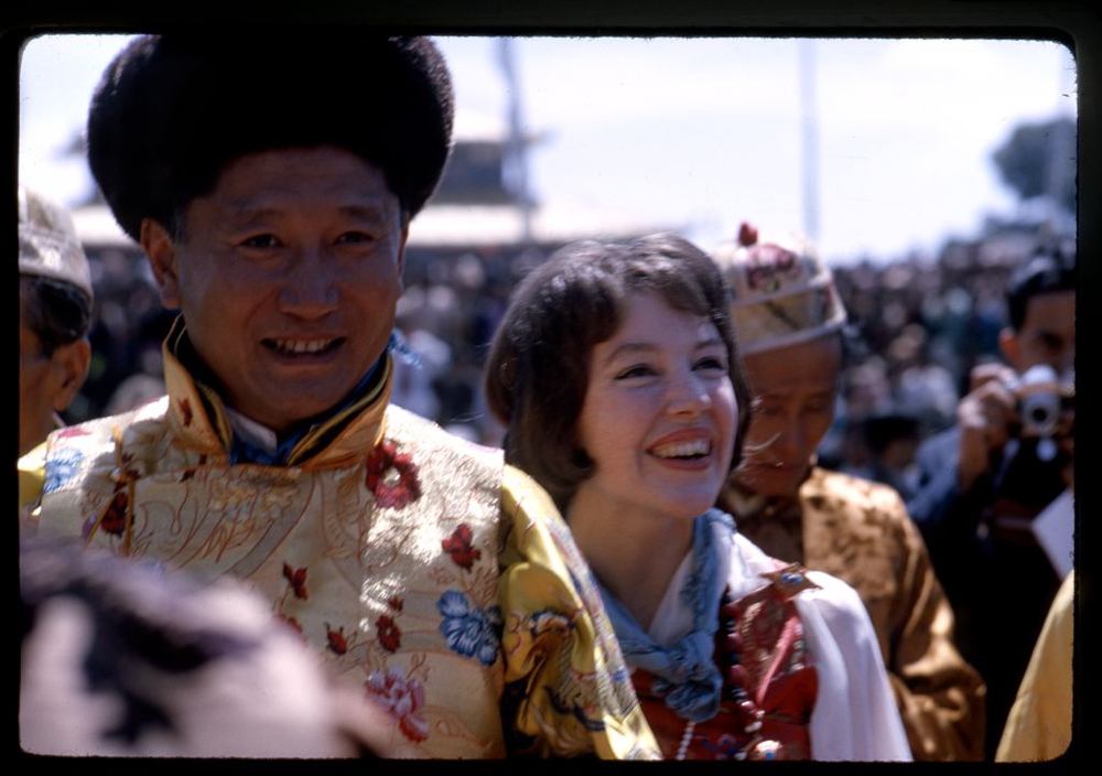 Photograph shows the newly-crowned King Palden Thondup Namgyal and Queen Hope Cooke walking in procession, Gangtok, Sikkim.