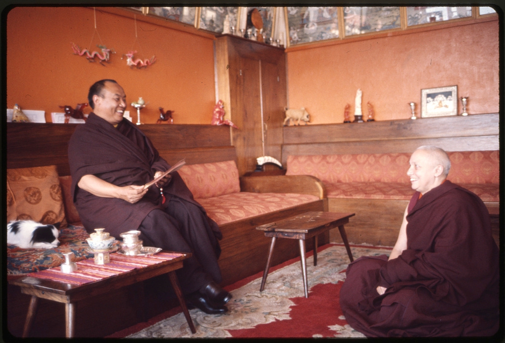 Rangjung Rigpe Dorje, the 16th Karmapa Lama, seated, with a monk, at Rumtek Monastery, Sikkim