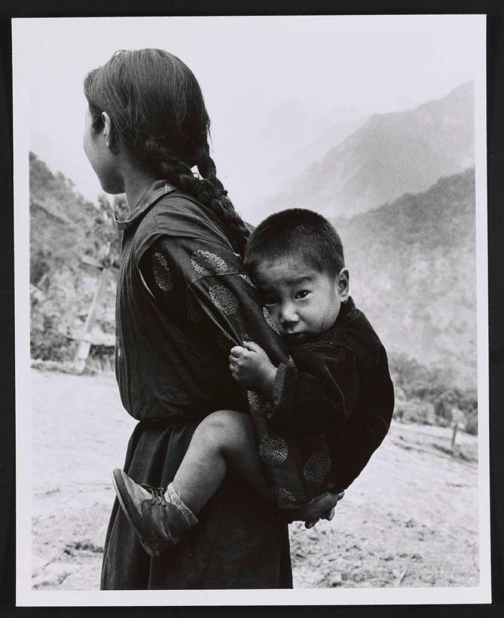 Young woman with a small child on her back, Sikkim