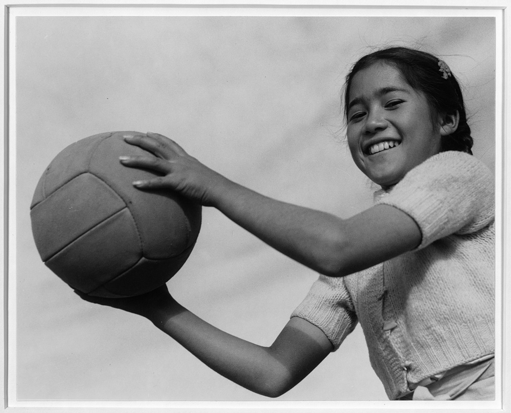 Girl and volley ball, Manzanar Relocation Center, California