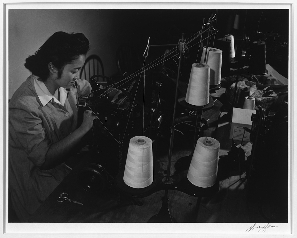 Sumiko Shigematsu at power machine, Manzanar Relocation Center, California