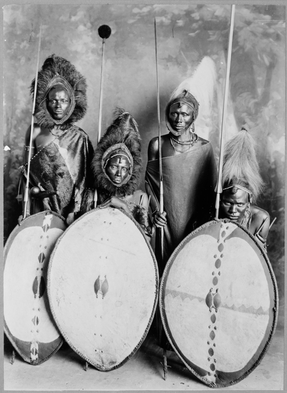 Four masai warriors in full war dress, Kenya