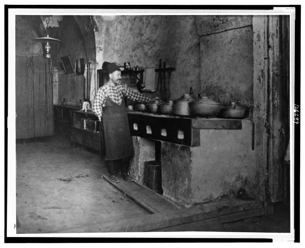 Palestine - Jerusalem--Food being cooked over a limestone slab in a Turkish restaurant