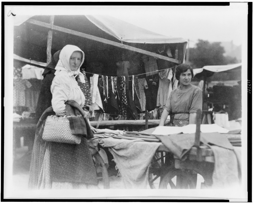 Woman shopping for textiles at market, Hungary