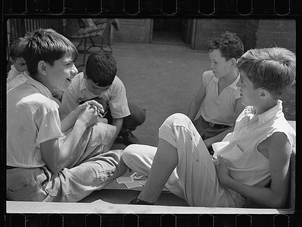 Boys playing cards near Union Station