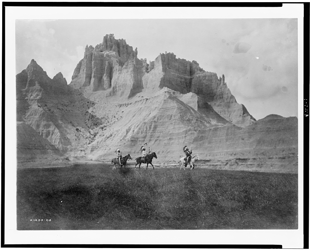 [Entering the Bad Lands. Three Sioux Indians on horseback]