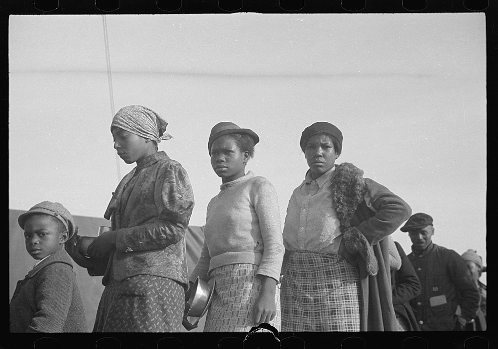 Negroes in the lineup for food at meal time