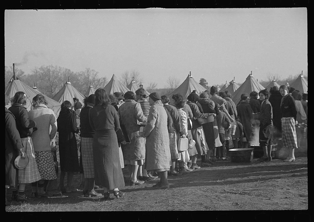 Refugees lined up at meal time in the camp