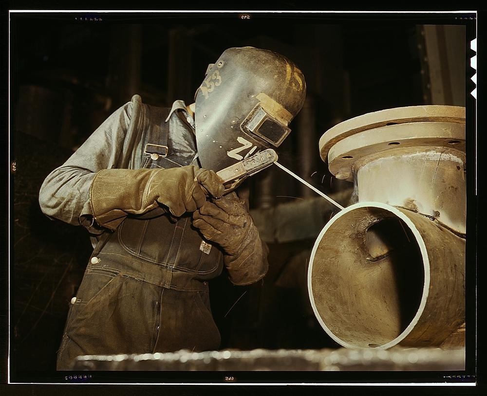 Welder making boilers for a ship