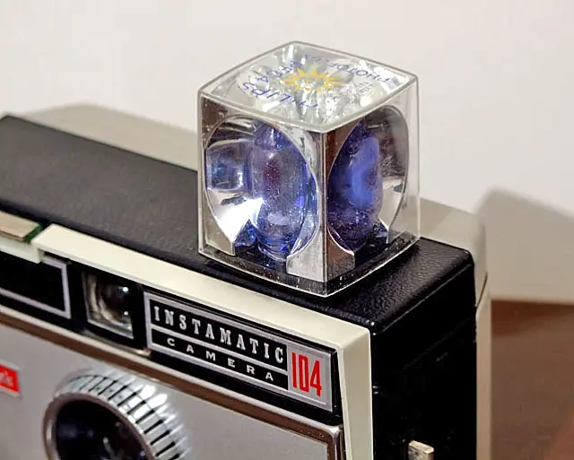 A flashcube fitted to a Kodak Instamatic camera.