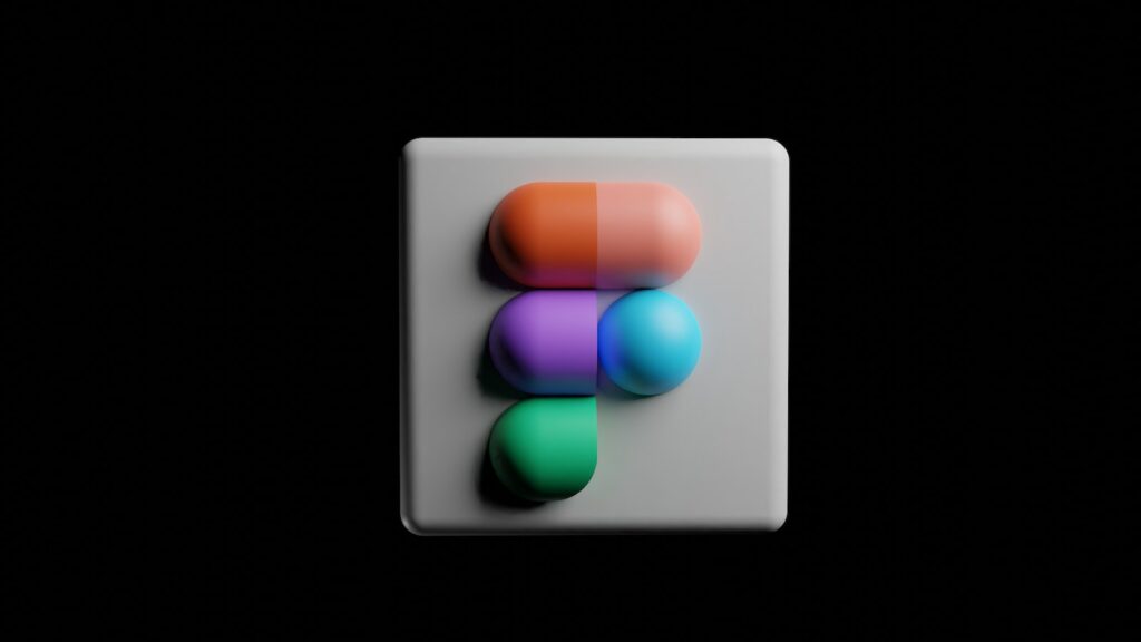 a white square button with a multicolored object on it