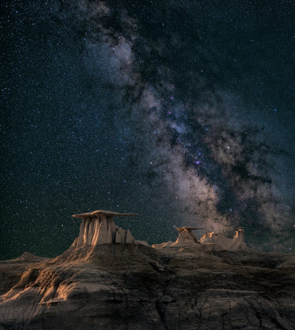 brown mountain under starry sky