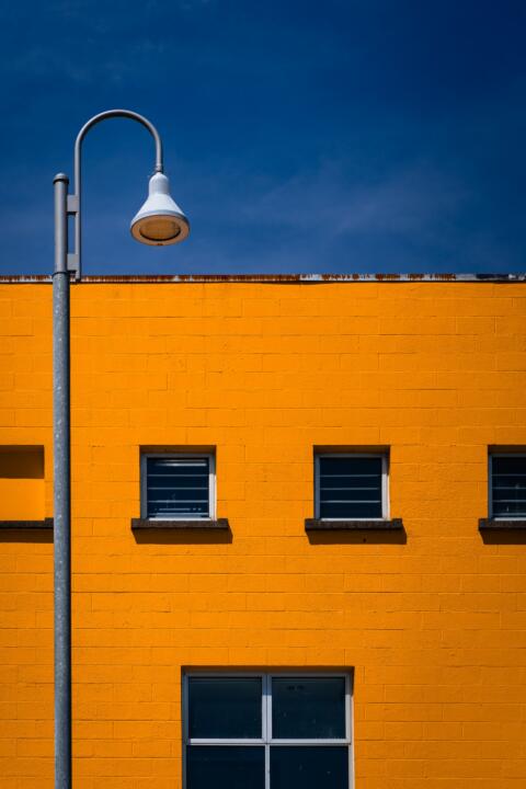 a lamp post in front of a building