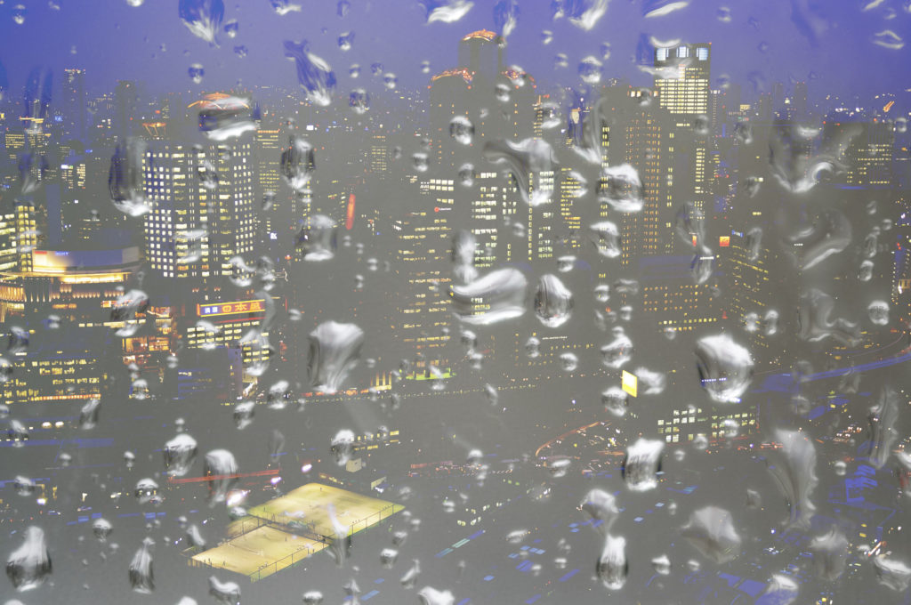 Raindrop textures blended over a cityscape using Lighten blend
