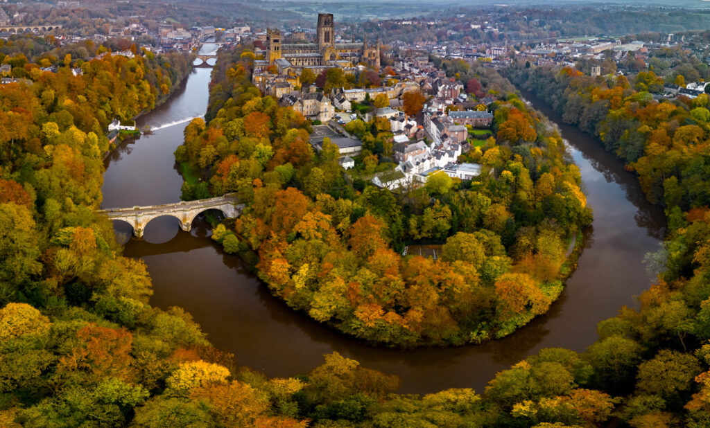 Aerial panoramic view of the entire city of Durham and River Wear at the height of autumn