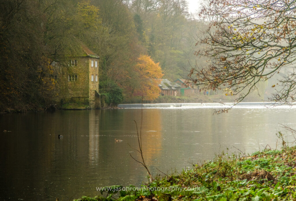 A derelict mill on the mist banks of the River Wear in Durham 