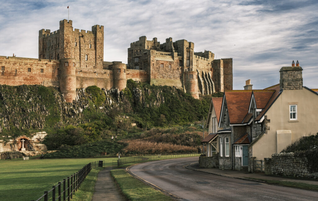 Bamburgh Castle in Northumberland, England . Shot in golden light of a winter morning 