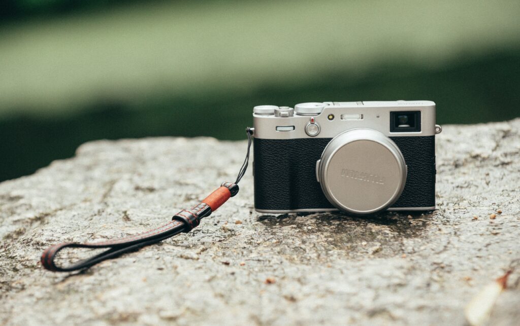 A Fuji X100 series camera on a rock camera settings street portraits