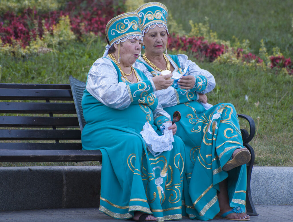 Two Ukrainian ladies enjoying an ice cream on a bench in Odesa