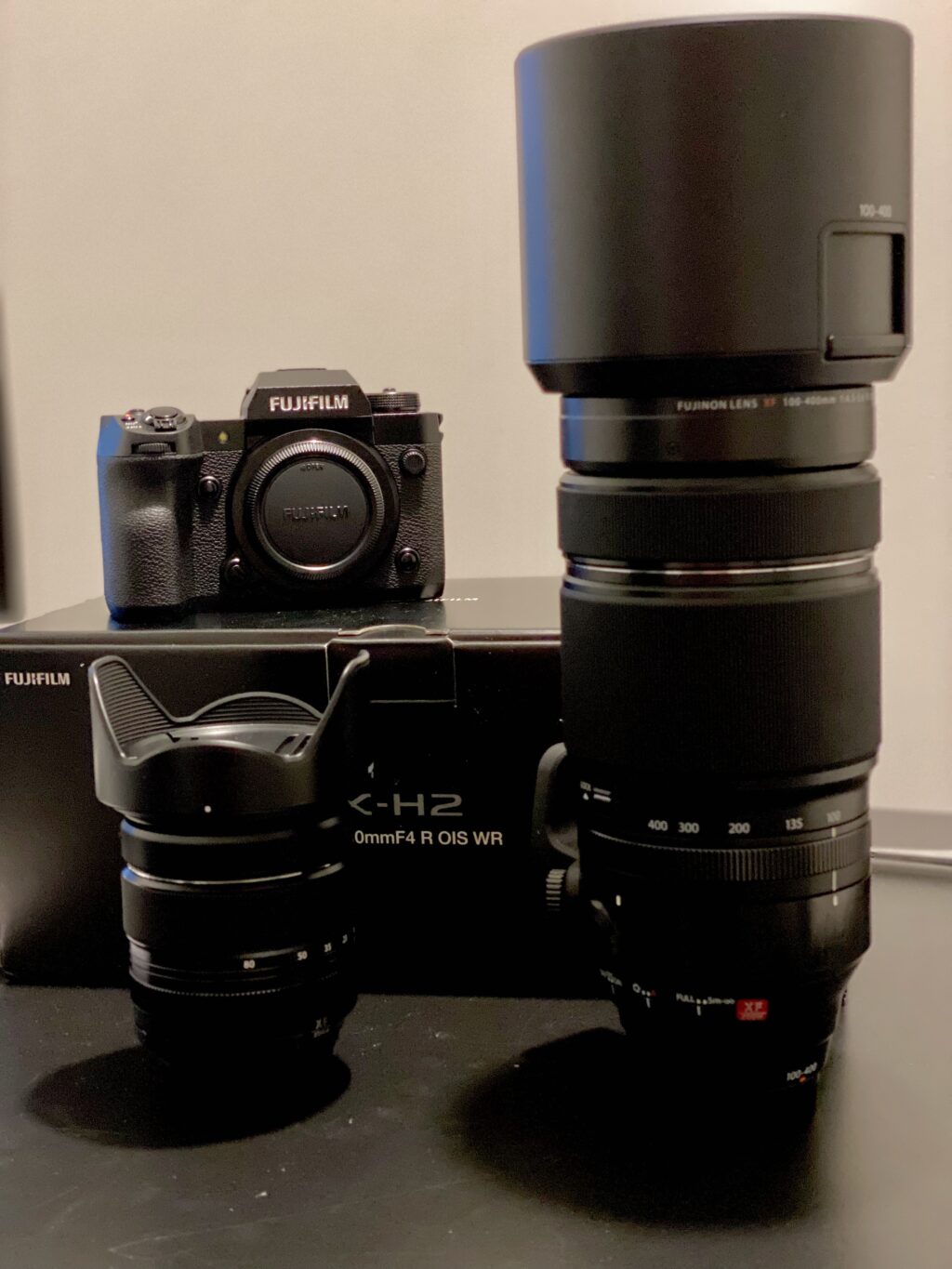 A selection of Fujifilm camera equipment on a desk.