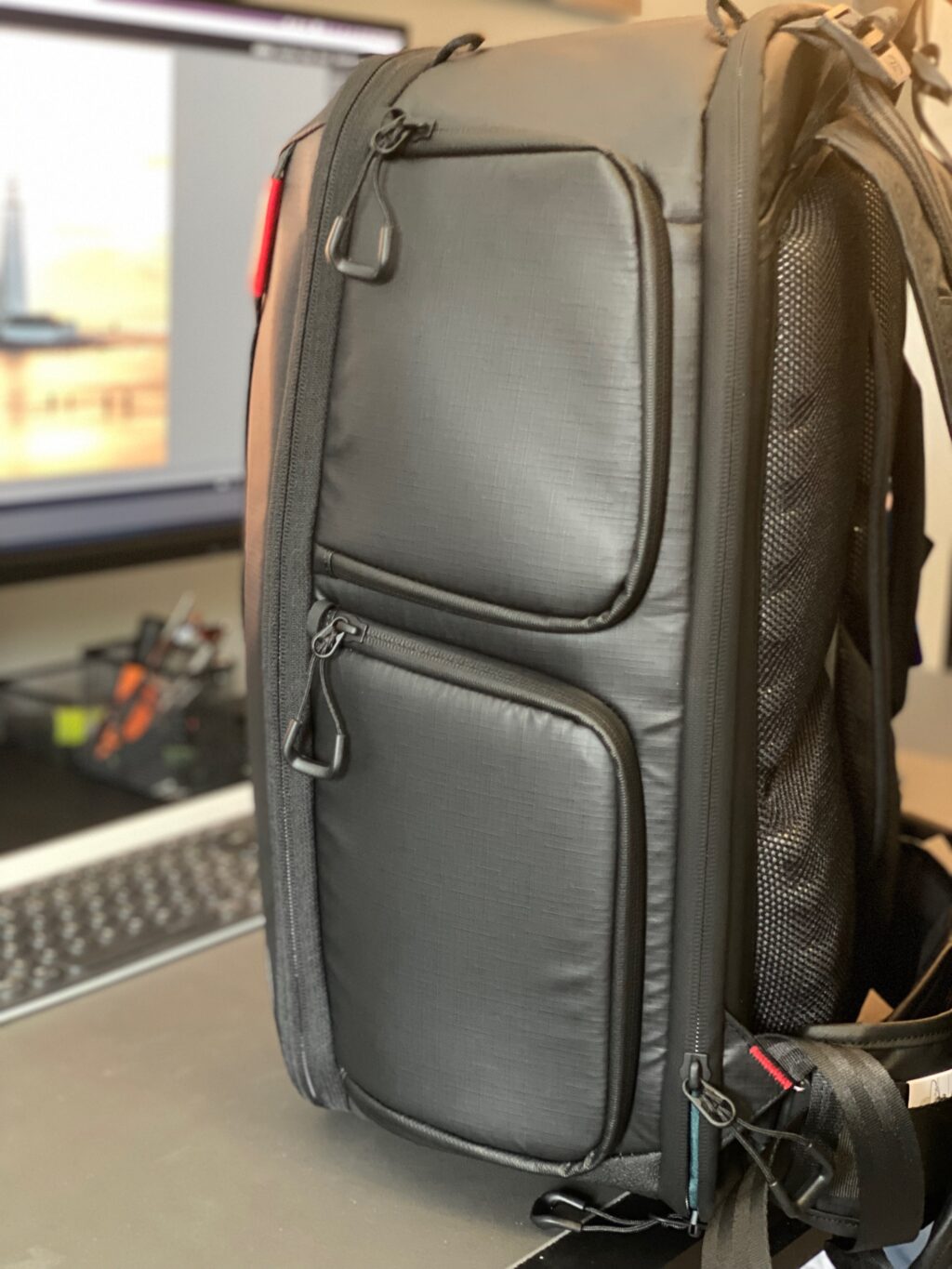Side view of a PGYTech camera bag on a photographer's desk