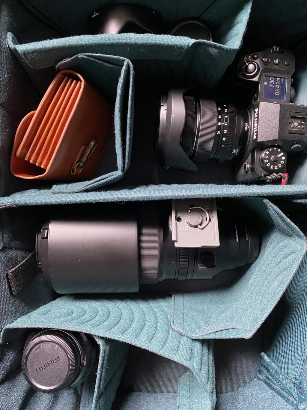 A PGYTech backpack with Fujifilm camera sytem inside.