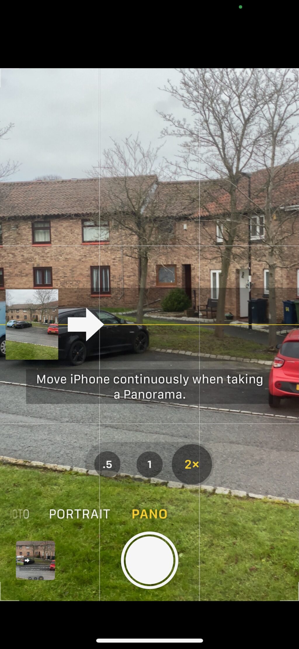 Screenshot of an iPhone creating a panoramic image