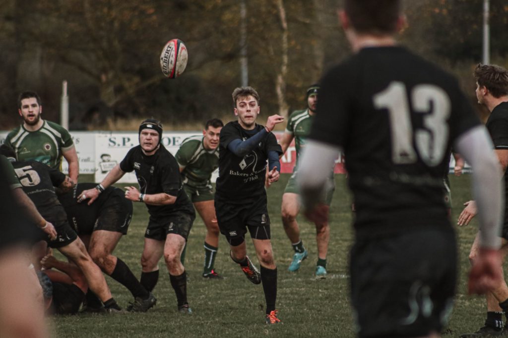 a group of people playing rugby