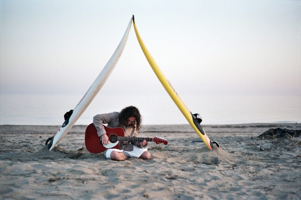 male pose with guitar