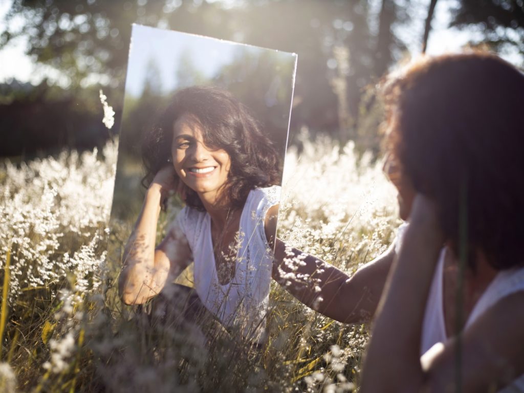 Woman in yoga pose outdoors in nature 1900428 Stock Photo at Vecteezy