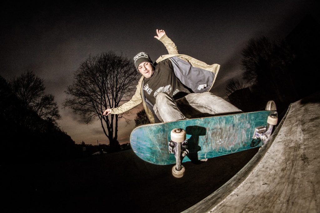 a man doing a trick on a skateboard