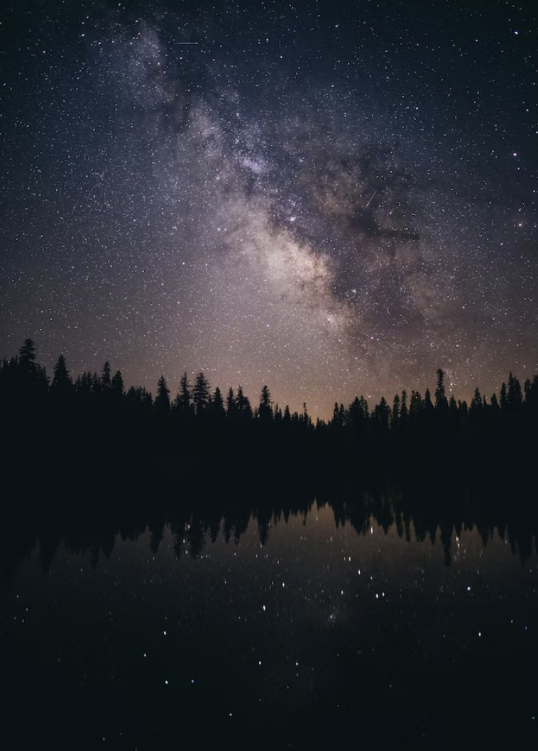 milky way above lake