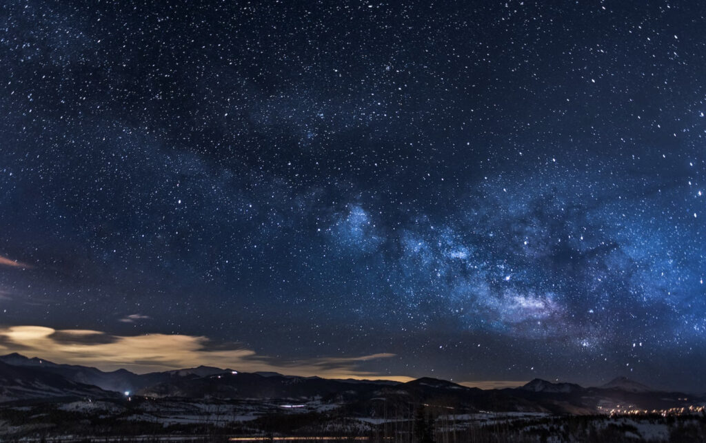 blue night skies over mountain top