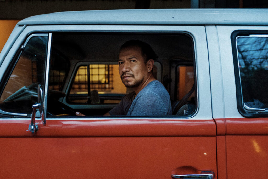 man in a red truck
