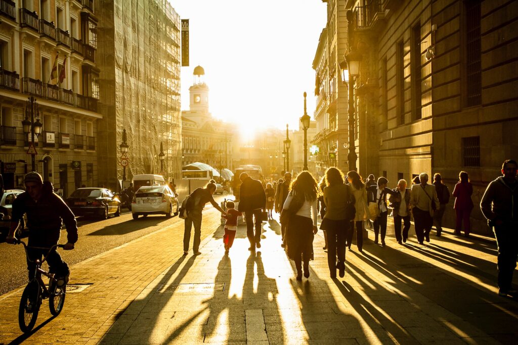 people walking golden light