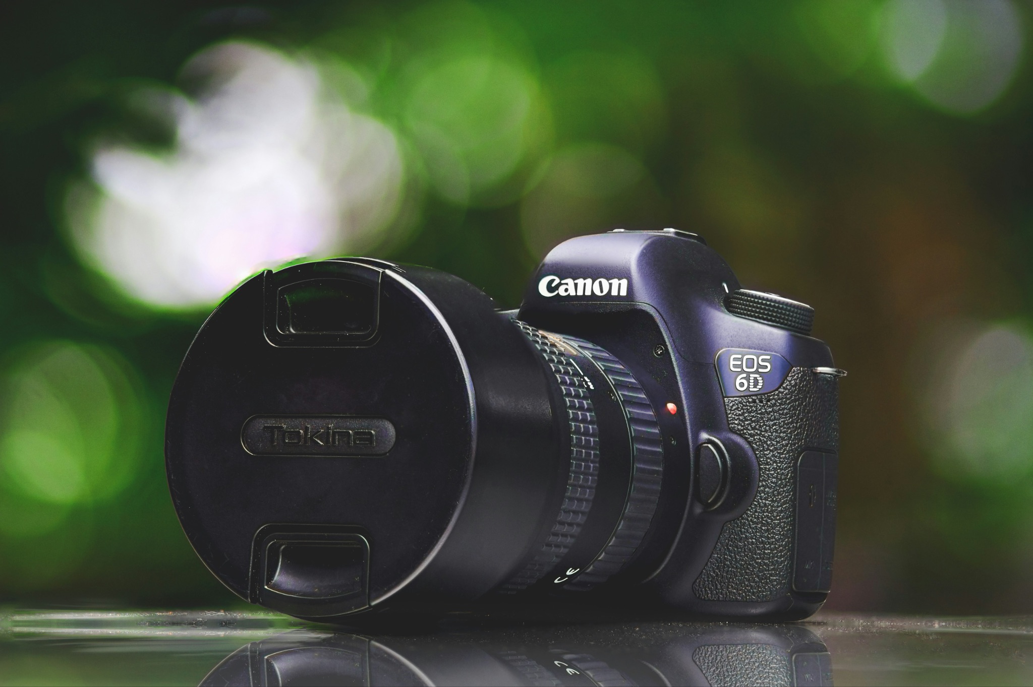 A Canon EOS 6D DSLR camera and lens