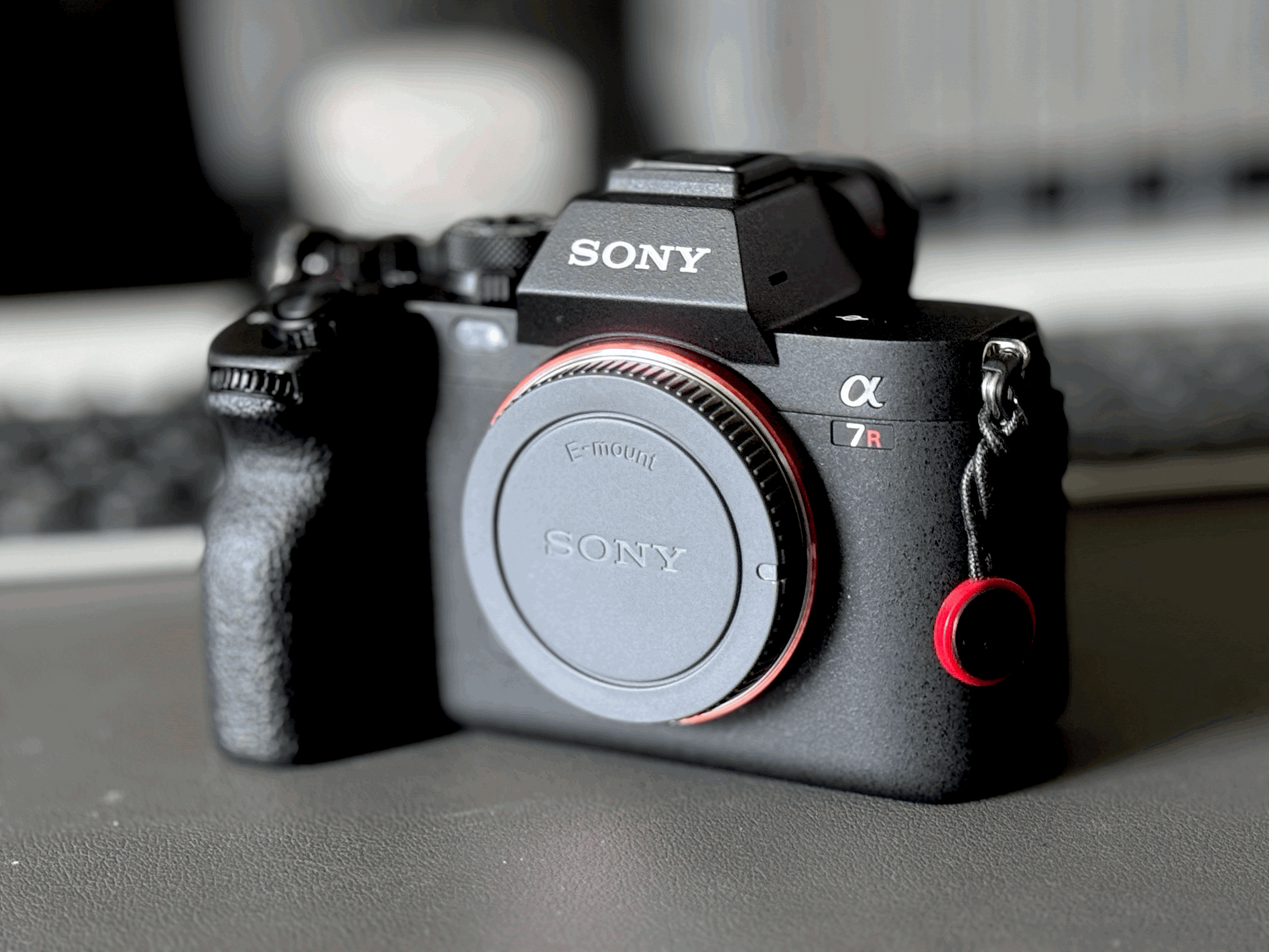 A Sony a7RV body on a grey mat