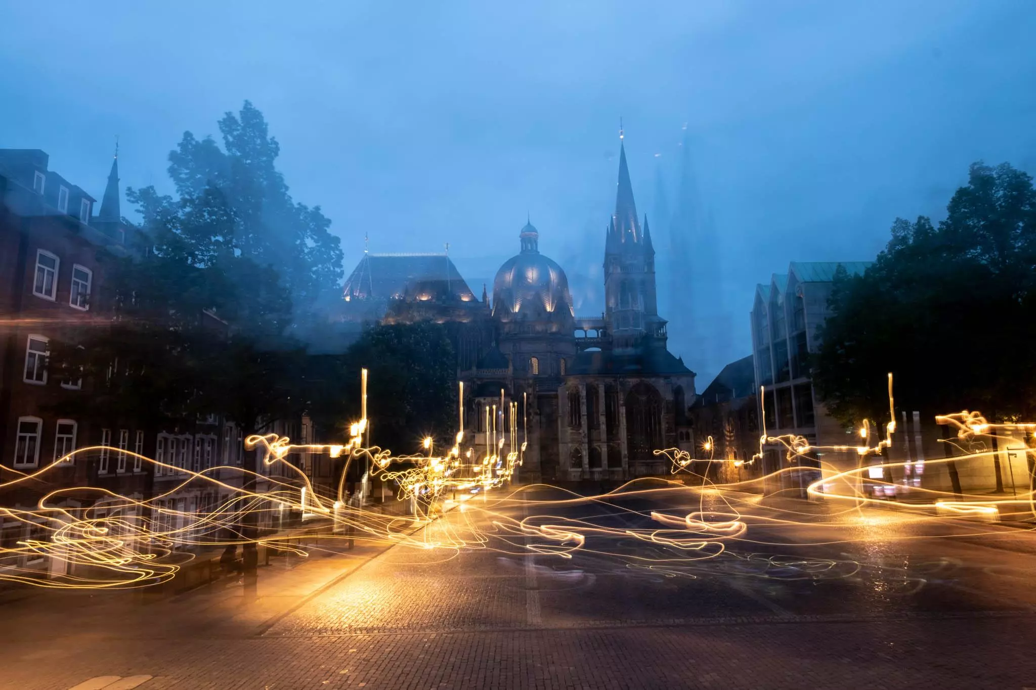 Aachen Cathedral in blue hour. The image is blurred do to an unintentional camera movement