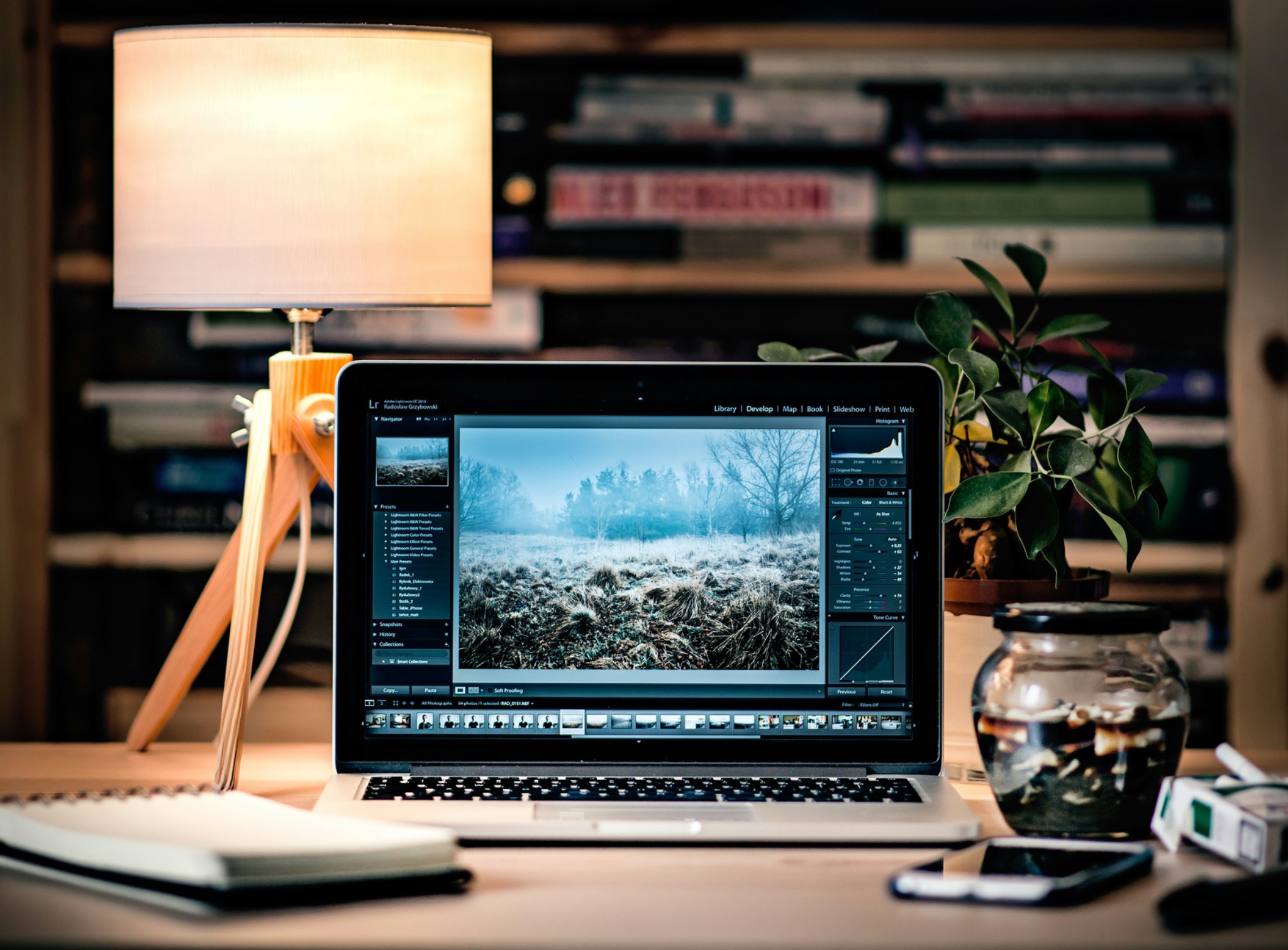 An Apple laptop with photo editing software