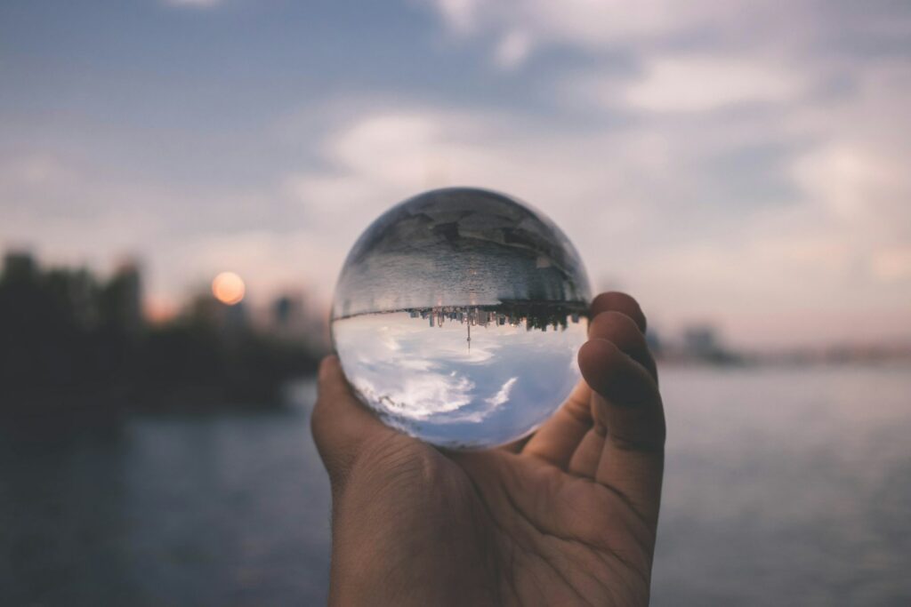 person holding crystal ball